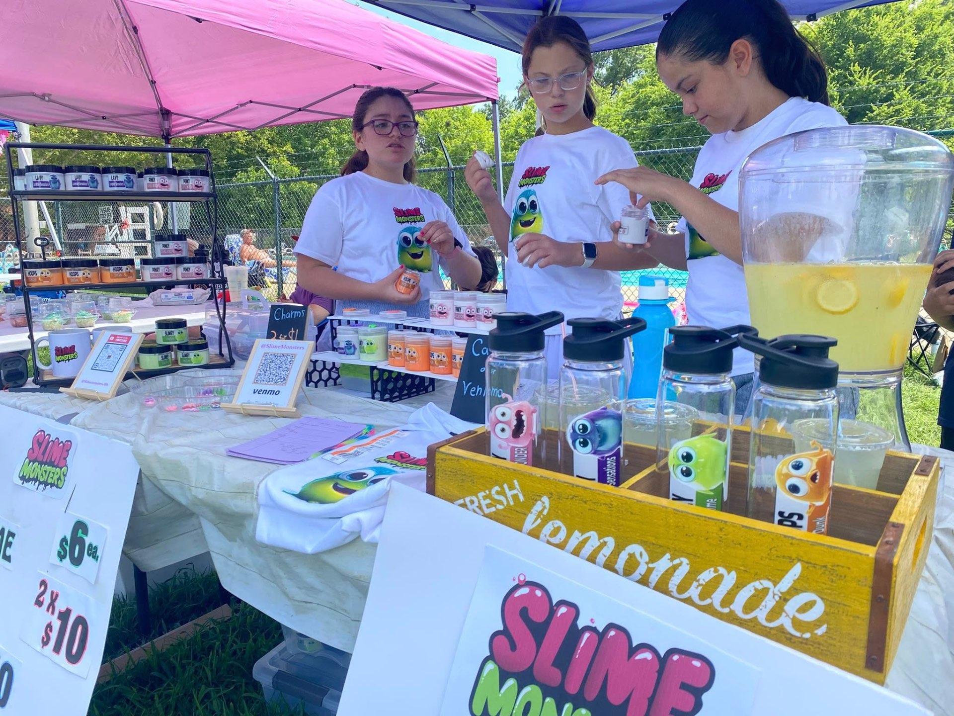 Team members creating slimes and serving customers